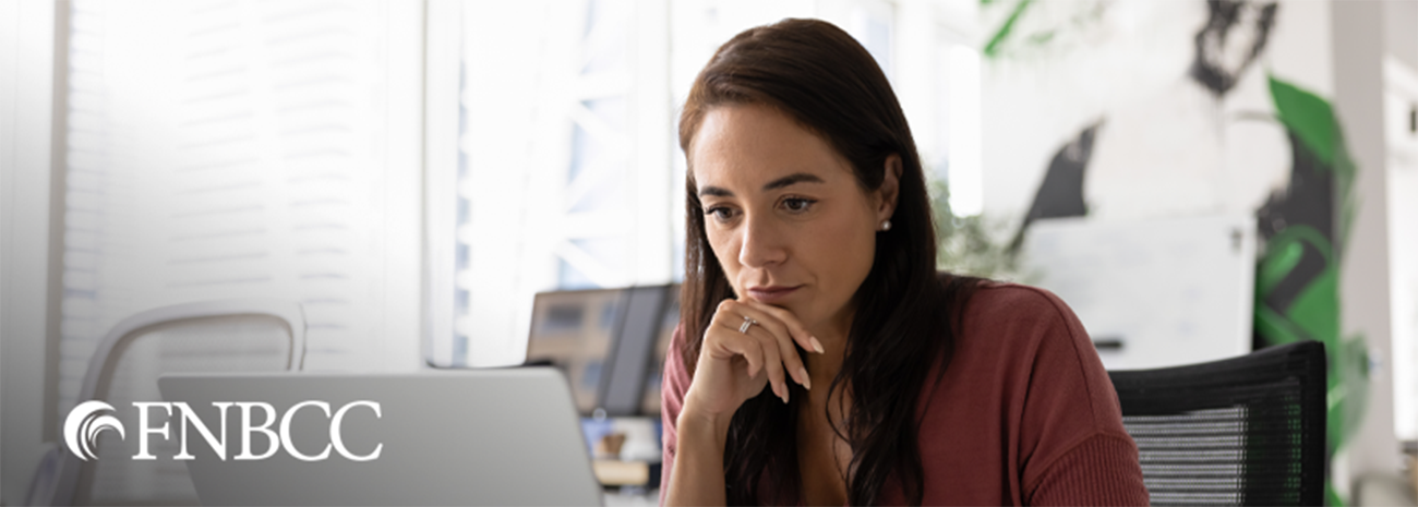 Business owner at her computer in her office