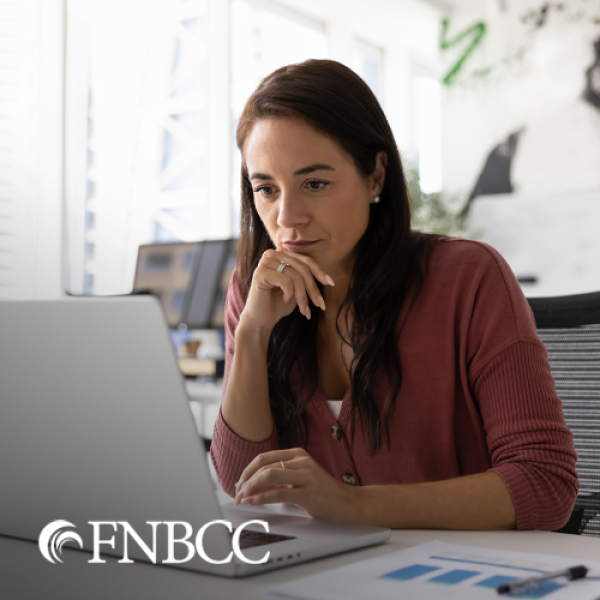 Business owner at her computer in her office
