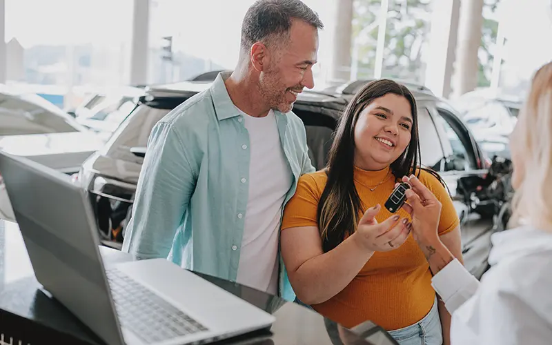couple buying new car